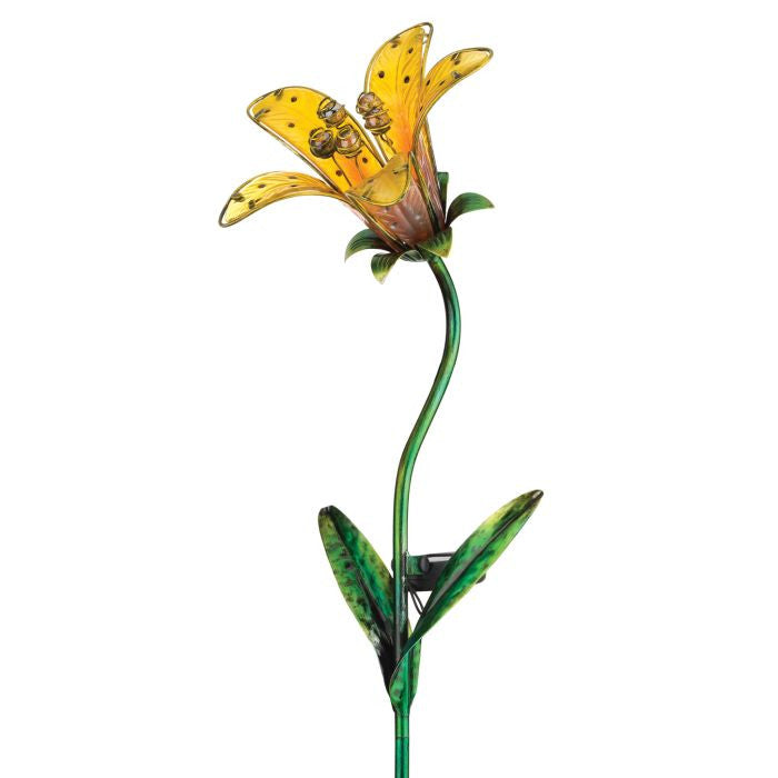 a close up of the yellow tiger lily solar stake against a white background