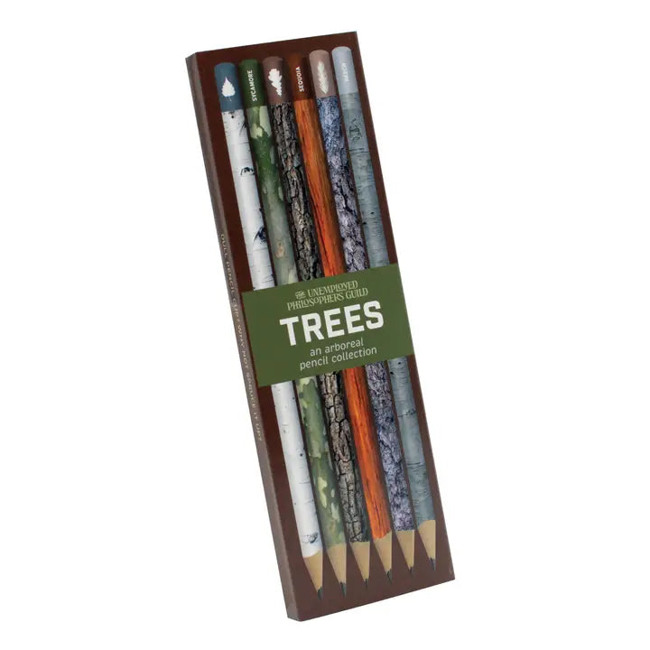 Set of pencils with tree designs in packaging on a white background