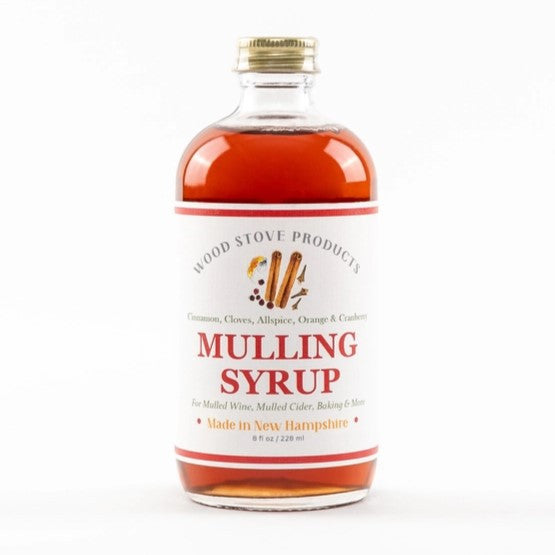 8oz mulling syrup bottle showing the warm colored amber liquid inside
