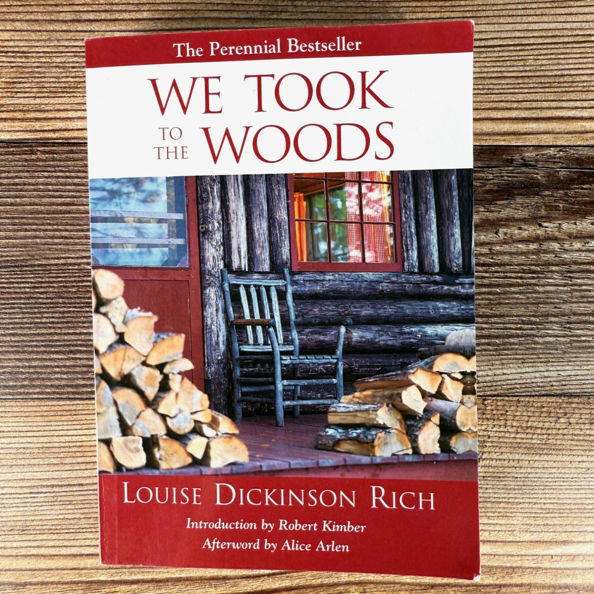 We Took to the Woods book on a rustic wood surface
