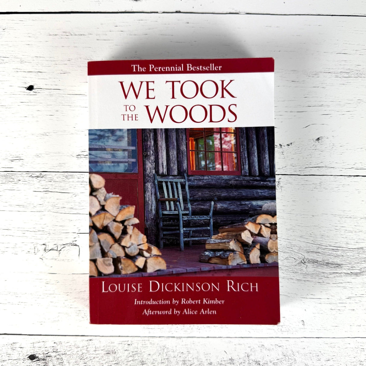 We Took to the Woods book on a white wood surface