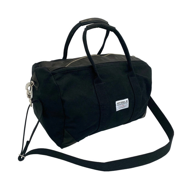 a front/side angle view of the black weekender bag