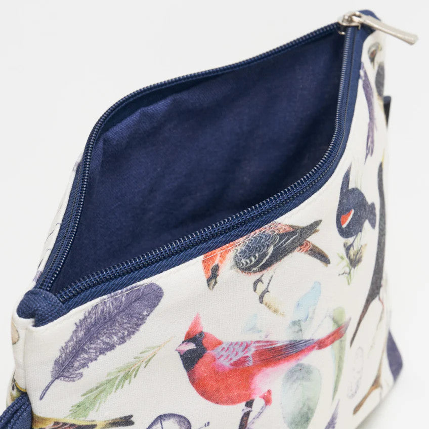 a close up of the birds zipper pouch showing the pouch unzipped revealing the solid navy blue lining
