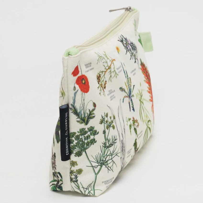 a side angle of white canvas zipper pouch with vintage illustrations of medicinal plants