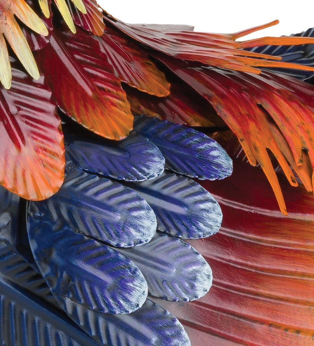 close up of the Arroyo Rooster decor's metal feathers, showing their fine detail and vibrant colors