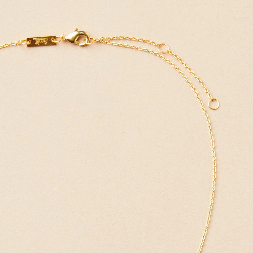 close up of the gold chain that goes with the gibbous slice gold necklace