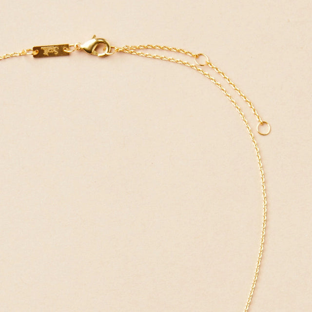 close up of the gold chain that goes with the gibbous slice gold necklace
