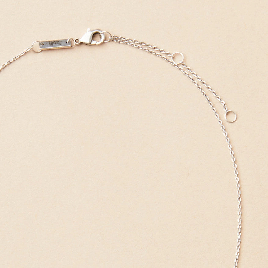 close up of the silver chain that goes with the crescent moon silver necklace