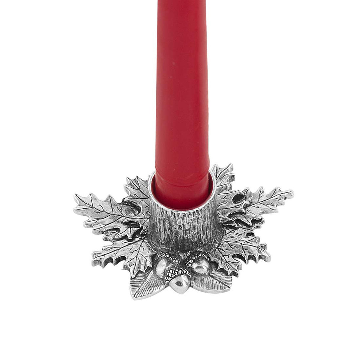 close up view of a detailed candleholder with autumnal leaf shapes and acorns surrounding the base of the candle holder and holding a red candle