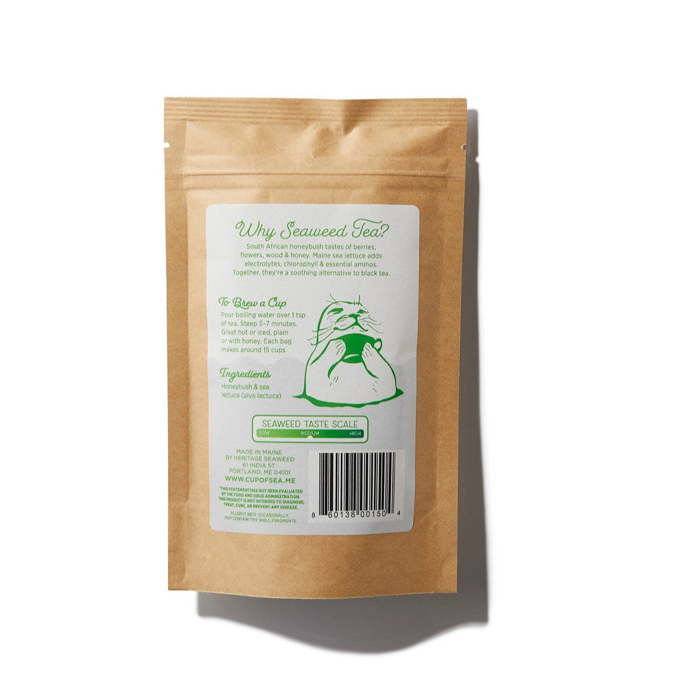 the back of the sailor's cure all seaweed tea package featuring seaweed health benefits, ingredients, brew guide, a graphic showing that this tea has a medium seaweed taste, and a graphic of a seal rising out of the sea holding a cup of tea