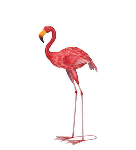 Metal sculpture of a flamingo standing upright, painted in vibrant shades of pink and red with detailed feather textures. The flamingo has a curved neck, a yellow and black beak, and long, thin legs with webbed feet. The sculpture is designed with a smooth, glossy finish, capturing the iconic pose of a flamingo in a minimalist style