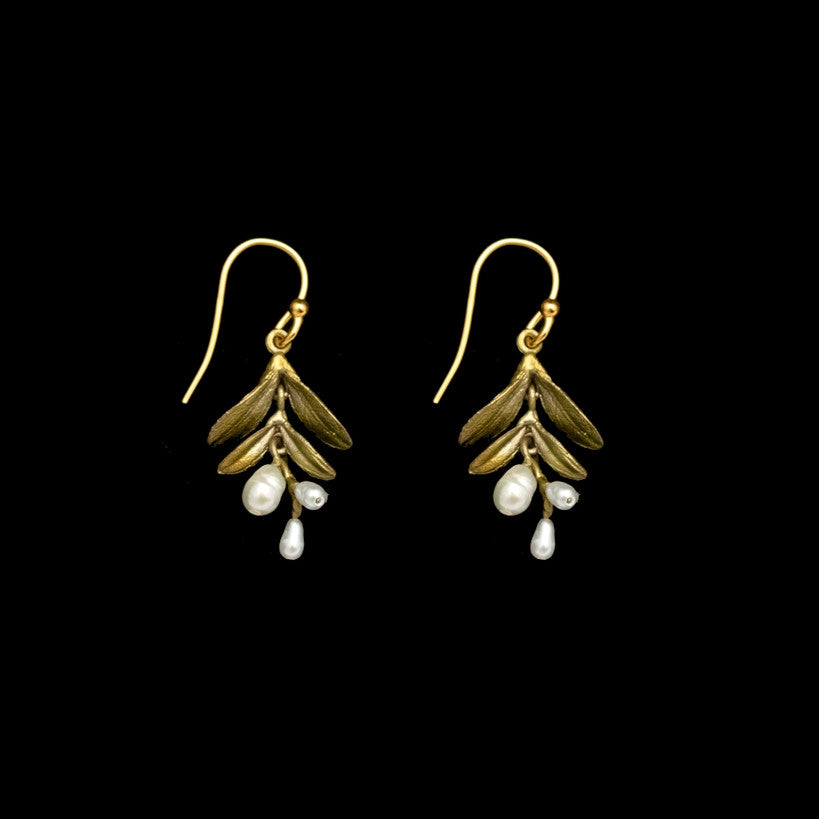 a pair of patinated bronze earrings resembling petite vine leaves with a trio of freshwater pearls dangling from the leaves all hanging from gold earring wire