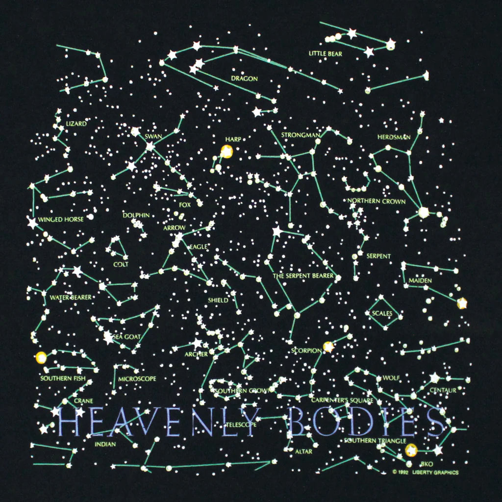 close up of the front of the tee design featuring constellations and "Heavenly Bodies' text