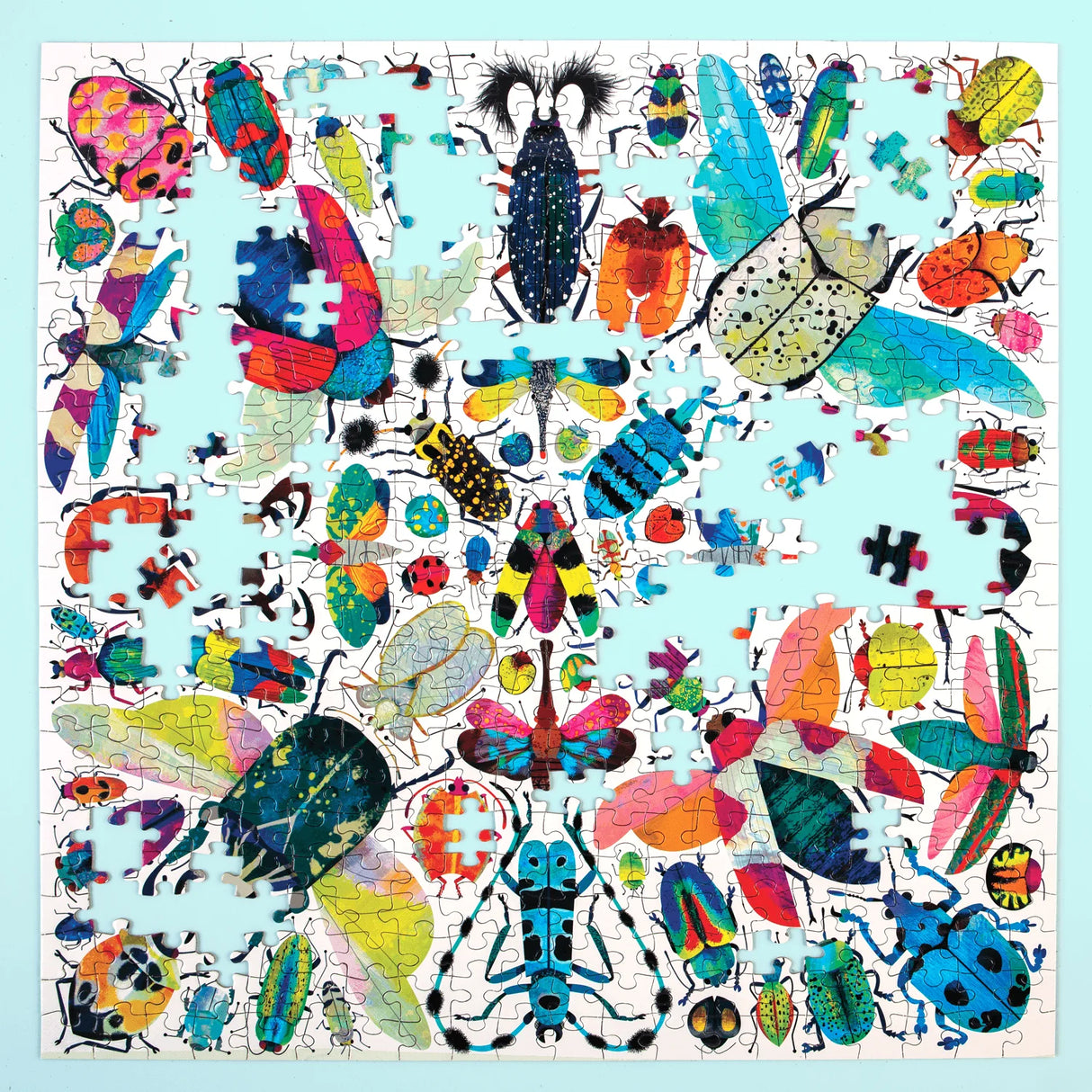 Colorful insect-themed puzzle on a light blue background