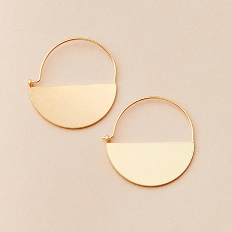 a pair of gold hoop earrings that form a half circle like a half full moon
