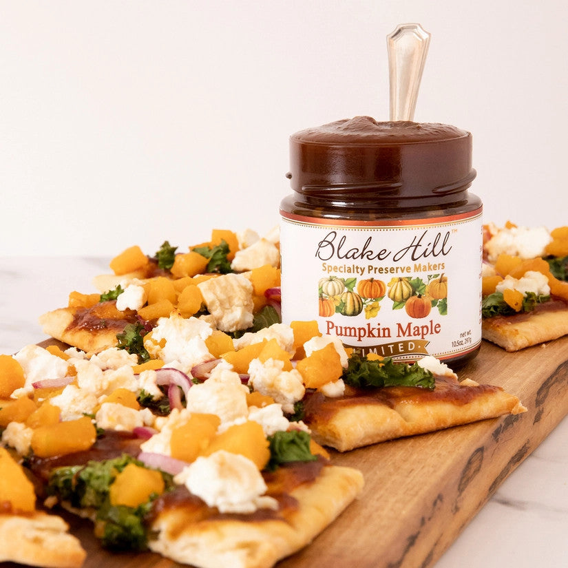 a board with flatbread and a jar of pumpkin maple butter