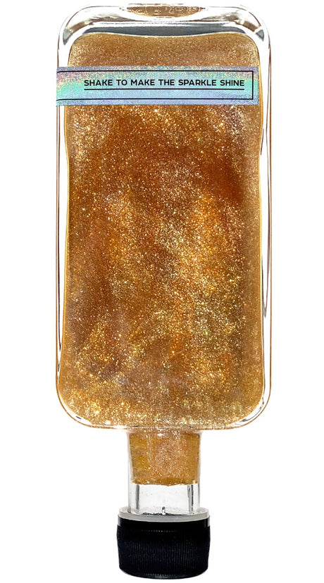 upside down, back side of the bottle showing the label that reads "shake to make the sparkle shine"