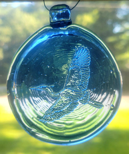 Blue colored glass suncatcher with a heron design.