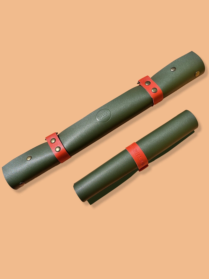 the table top potting mat rolled up to show its versatility and ease of storage