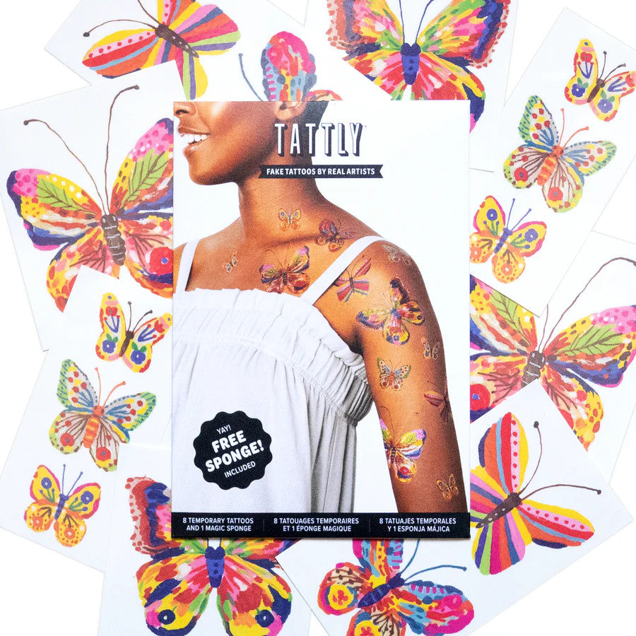 the whole set of 8 tattoos of the fluttering colors tattoo set - each is vividly colorful and painterly in style, surrounding the package for the set