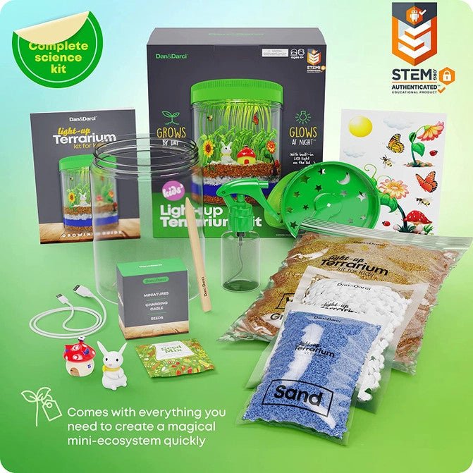 The light up terrarium package and full contents showing the container, light up lid, charging cable, sand, rocks, soil, decorative figures, stickers, spray bottle and tools