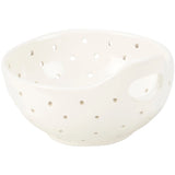 White ceramic colander with small holes on a white background