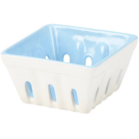 White ceramic berry basket with blue accents on a white background