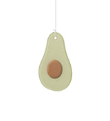 An avocado-shaped ceramic ornament or wall hanging suspended by a thin white string against a plain white background.