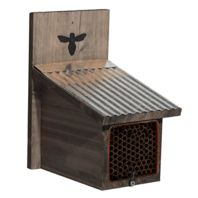 The rustic mason bee house with 94 nesting tubes, corrugated metal roof, and bee emblem