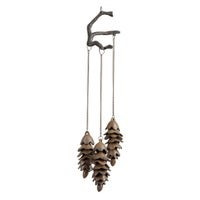 three pinecones that hang from a crooked branch