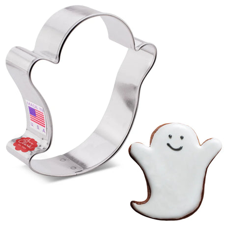 a ghost shaped cookie cutter alongside a decorated ghost shaped cookie