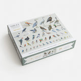 Jigsaw puzzle box with bird illustrations on a white background
