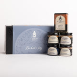 Curio Spice Gift Set featuring a light blue and black gift box labeled 'Baker's Joy' alongside five spice jars and one tin of Kandy Spice on a clean white background.