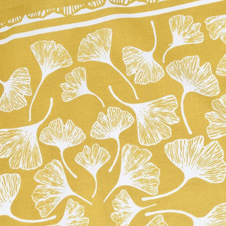 close up of illustration detail of White ginkgo leaf pattern on a mustard yellow bandana