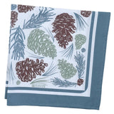 folded bandana with pine cone and leaf pattern on a blue background