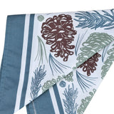 folded bandana with pine cone and leaf pattern on a white background