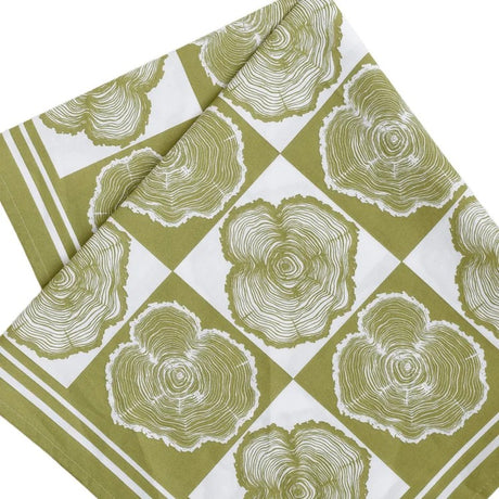 folded bandana with tree ring pattern on a green and white checkered background