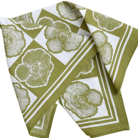 Green and white patterned bandana with tree ring design on a white background