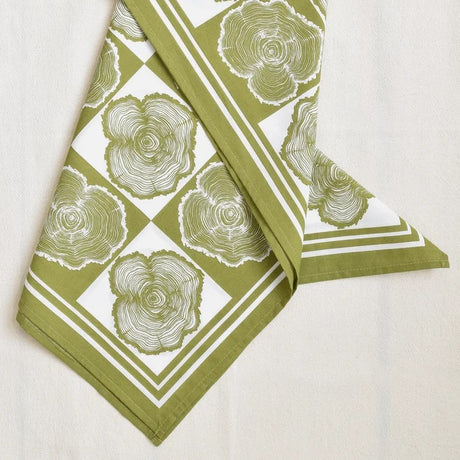 Green and white patterned bandana on a white background