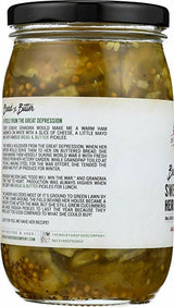 A jar of Pickled Herbs and Herbs and Herbs with a black lid and a white label showing the back text, photographed on a white background.