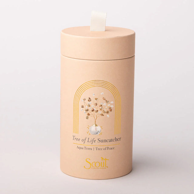 Beige cylindrical container with 'Scout' branding and 'Tree of Life Suncatcher' design on a light gray background