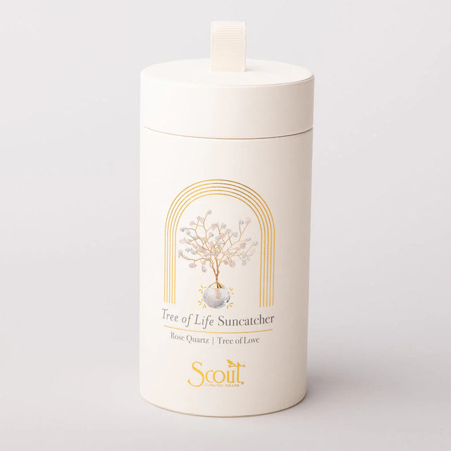 White cylindrical container with 'Scout' branding and 'Tree of Life Suncatcher' design on a light gray background