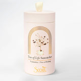 White cylindrical container with 'Scout' branding and 'Tree of Life Suncatcher' design on a light gray background