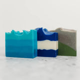 a trio of soaps in artful blue, white, and green colors