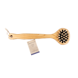 Wooden brush with black bristles and a card on a white background