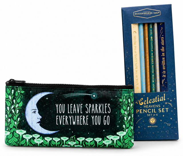 A decorative zip pouch in front of a blue pencil box. The pouch has a dark green and black celestial design with a crescent moon, stars, and the text 'YOU LEAVE SPARKLES EVERYWHERE YOU GO.