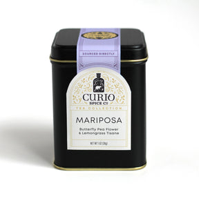 the black tea tin for the Mariposa tea with elegant off white label and purple seal