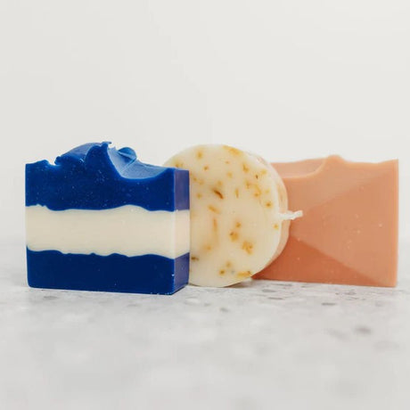 the three soaps in the Day at the Beach gift set: Ultramarine, Sunshine Citrus, and Beach Rose