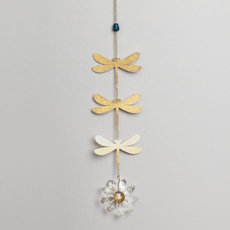 Decorative hanging chain with 3 brass dragonfly cutouts with a blue apatite stone above them and a crystal daisy hanging below