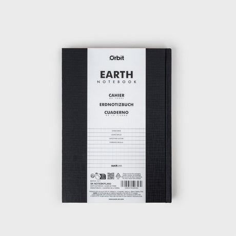Black notebook with white label on a light gray background